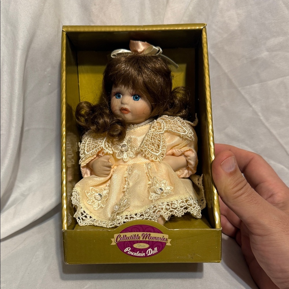 Collectible Memories Porcelain Doll with Brown Hair and Cream Dress Kmart